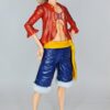 figurine of Luffy from One Piece, side view showing the two additional face pieces