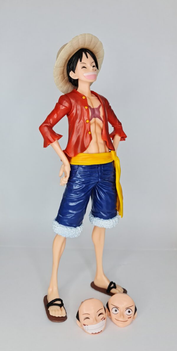 figurine of Luffy from One Piece, side view showing the two additional face pieces