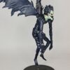 figurine of Ruyk from Death Note, floating and stretched wings, side view