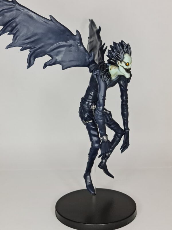 figurine of Ruyk from Death Note, floating and stretched wings, side view