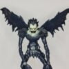 Close up of figurine of Ryuk from Death Note