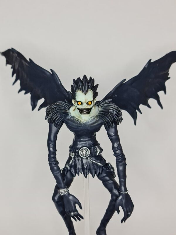 Close up of figurine of Ryuk from Death Note